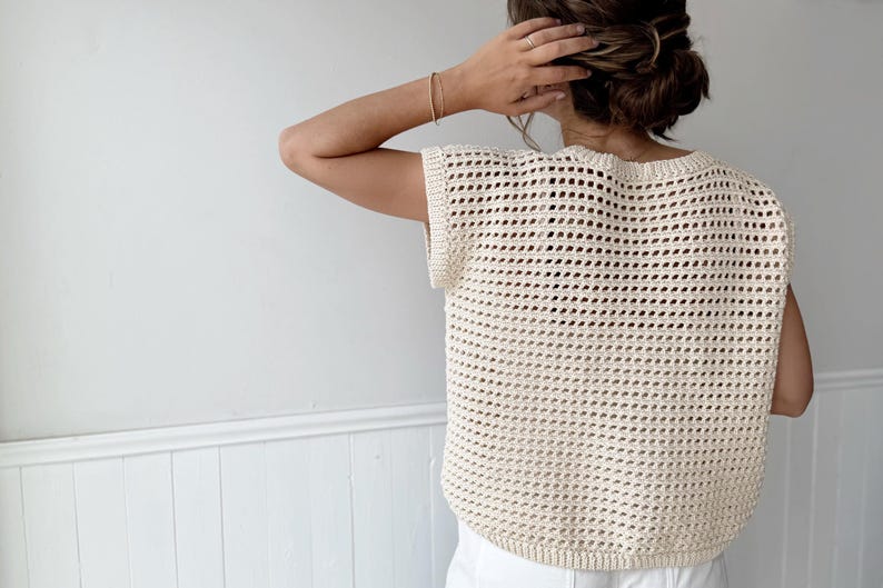 Cream open-weave rattan-style crochet top with short sleeves